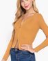 Beach Rose Co. ochre ribbed long-sleeve sweater top with a front zipper worn by a blonde model with blue jeans.