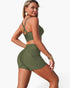 Beach Rose Co. olive green two-piece bikini with crisscross back straps and tummy control shorts on a model.