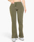 Beach Rose Co. olive green bootcut sweatpants with a drawstring waist and slant pockets on a model