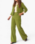 Beach Rose Co. olive green corduroy two-piece set with a button-front jacket and wide leg pants on a model.