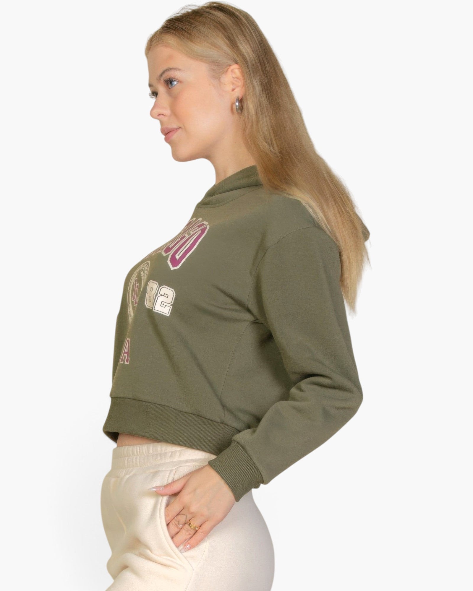 Beach Rose Co. olive green drop shoulder pullover hoodie with Chicago graphic, worn by a blonde woman in profile.