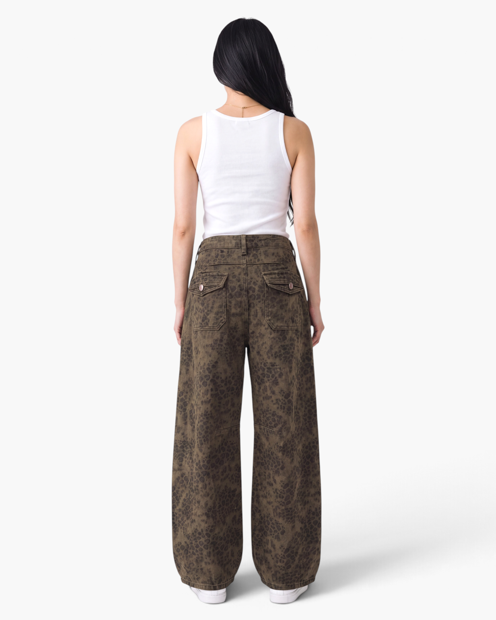 Beach Rose Co. brown leopard print barrel-leg jeans with buttoned back flap pockets and a relaxed fit.