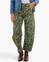 Beach Rose Co. olive green barrel leg jeans featuring a paisley print, styled with a denim jacket and brown boots.