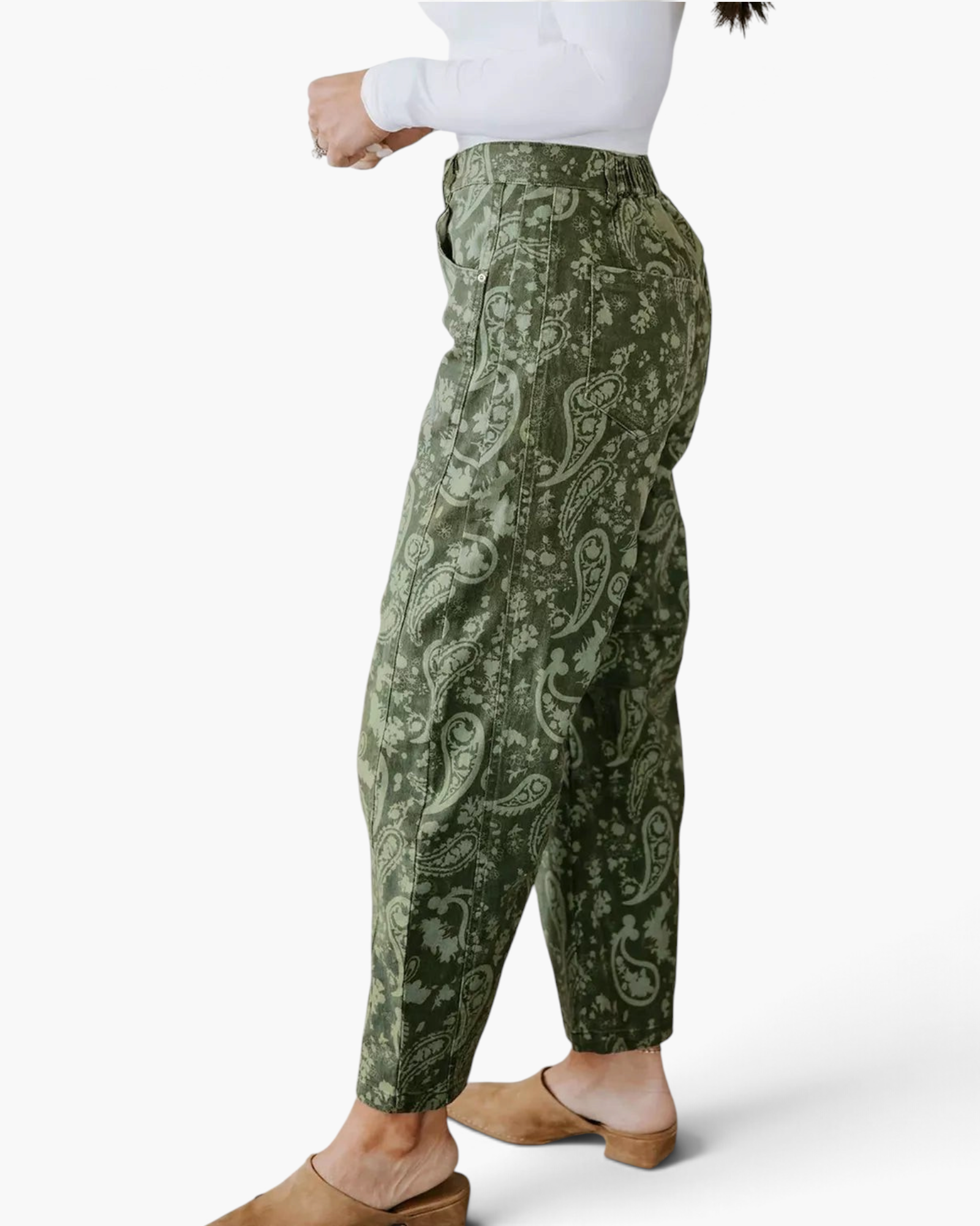 Beach Rose Co. olive green barrel leg jeans featuring a paisley and floral print, shown from a side profile view.