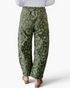 Beach Rose Co. olive green barrel leg jeans featuring a paisley and floral print, shown from the back view.