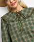 Beach Rose Co. olive and brown plaid top with an oversized ruffle sailor collar and long neck ties.