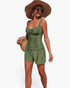 Beach Rose Co. olive green two-piece swimsuit with pleated tank top and shorts, worn by a woman with a sun hat.