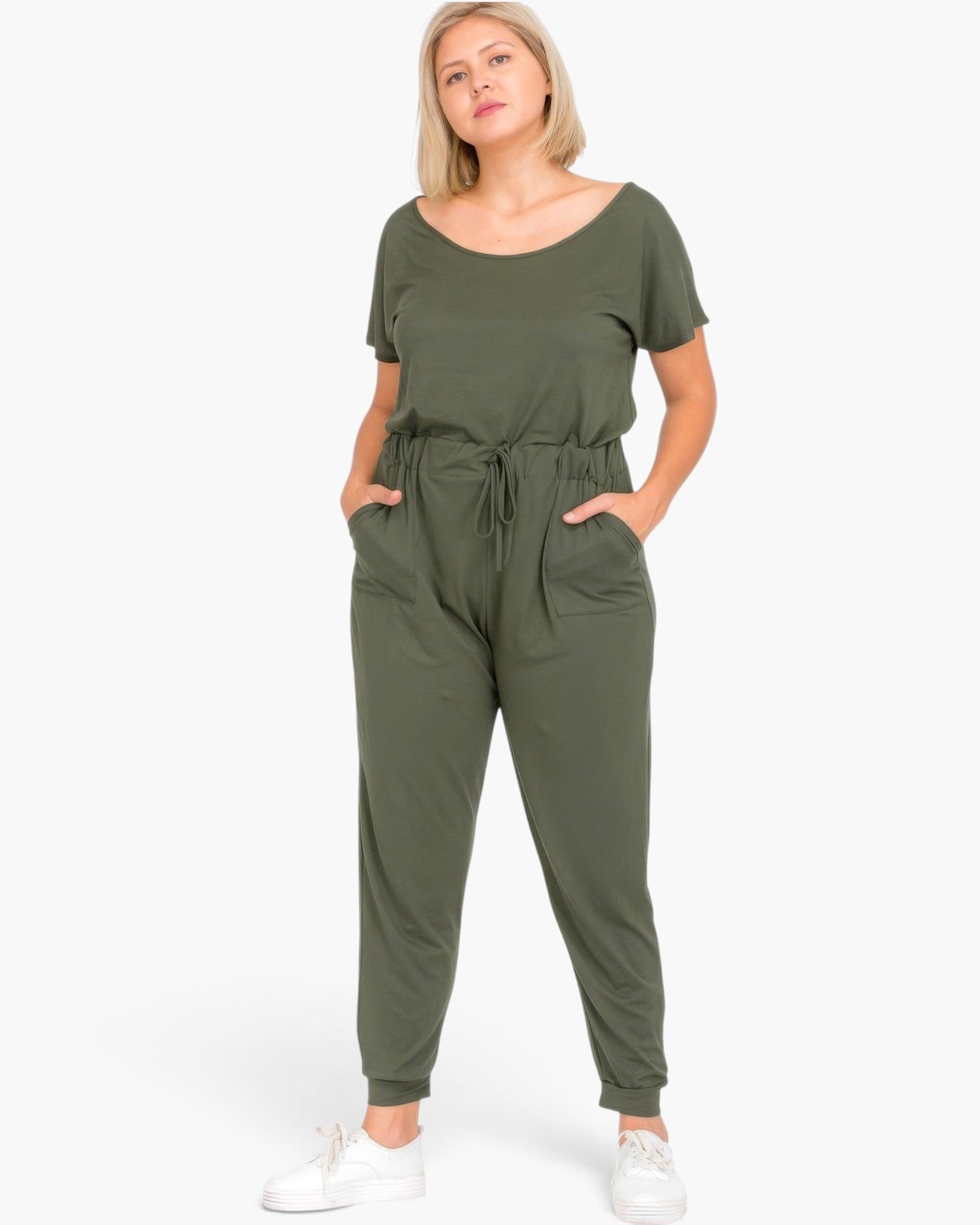 Beach Rose Co. plus size olive green short sleeve jumpsuit with a drawstring waist and pockets on a blonde model