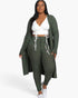 Beach Rose Co. plus size olive green ribbed long cardigan and leggings set worn by a model with a white crop top.