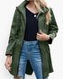 Beach Rose Co. olive green waterproof hooded rain jacket with a zip front, flap pockets, and a gathered waist.