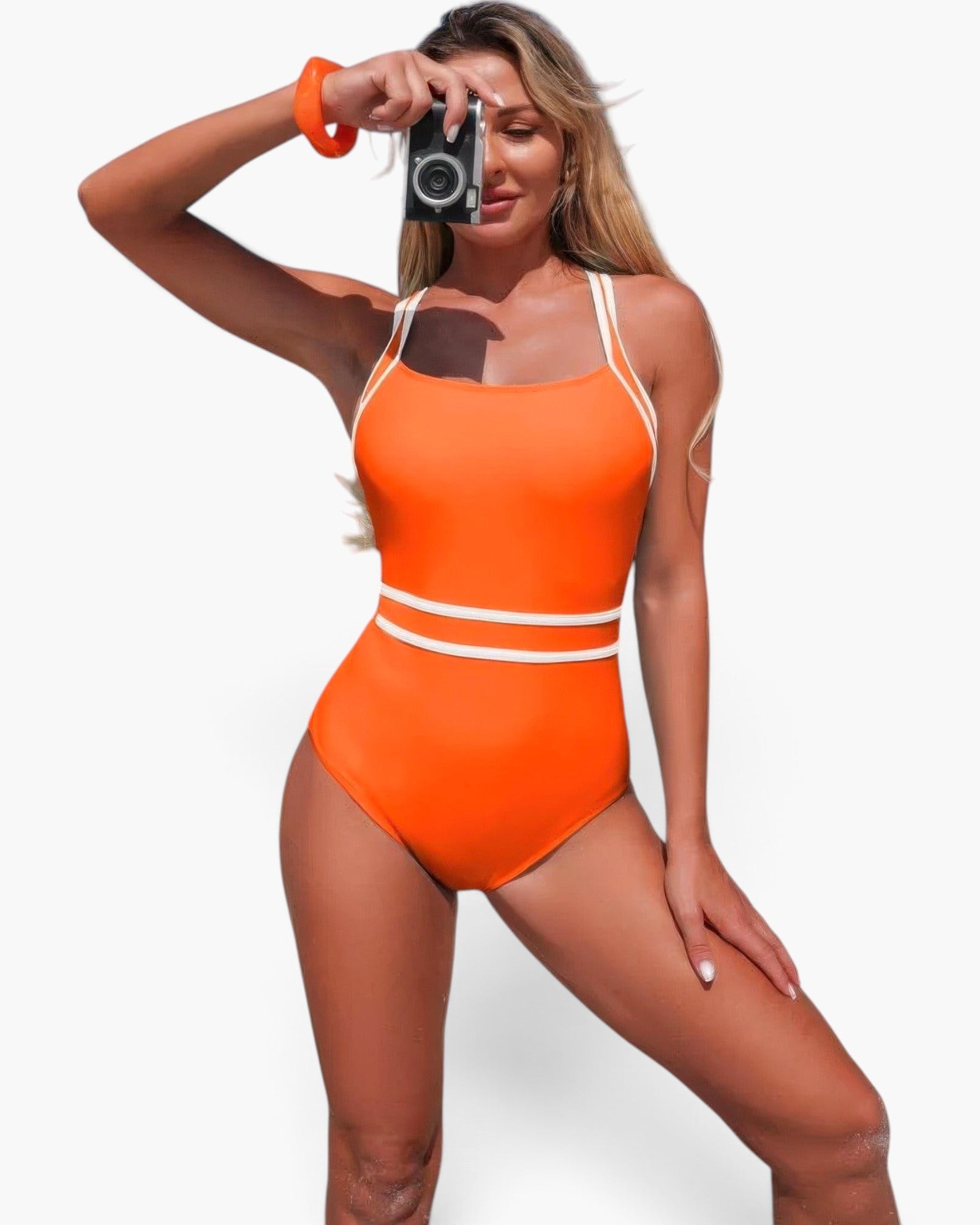 Beach Rose Co. orange one-piece swimsuit with white trim and cross-back straps worn by a woman holding a vintage camera