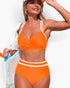 Beach Rose Co. orange two-piece bikini with cross-front top and high-waisted bottoms, worn by a woman with a cap.
