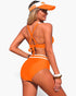 Beach Rose Co. orange high-waisted bikini with cross-back straps and white trim, worn by a model with a visor.