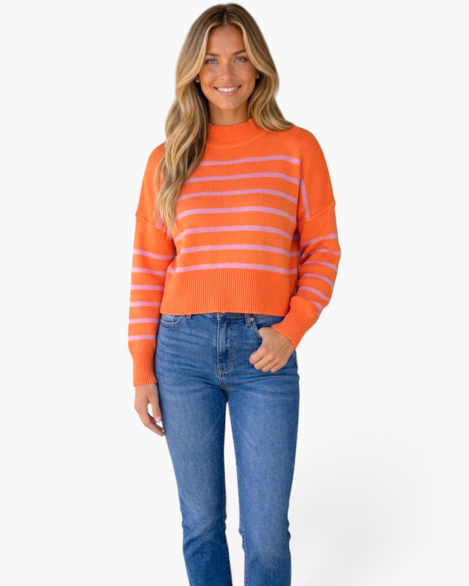 Beach Rose Co. orange and pink striped mock-neck sweater with dropped shoulders worn by a smiling blonde model.