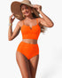 Beach Rose Co. bright orange two-piece bikini with high-waisted pleated bottoms and notched neckline on a beach model.