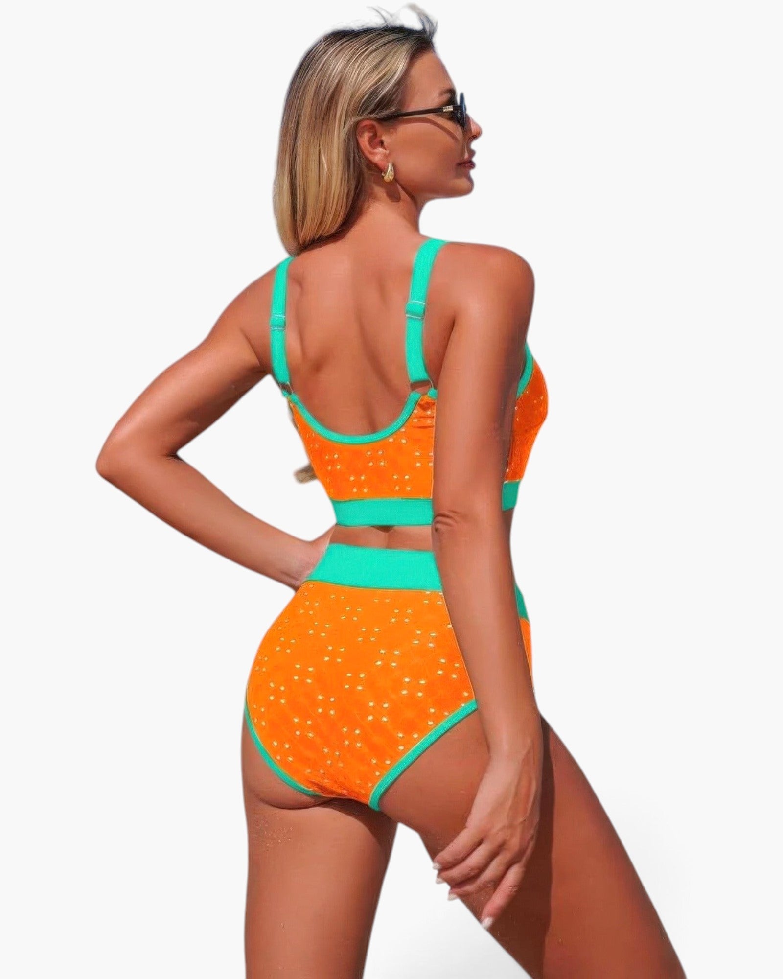 Beach Rose Co. orange polka-dot high-waisted bikini set with bright teal contrast trim worn by a model from behind.