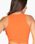 Beach Rose Co. orange ribbed tank top worn by a woman, showing a form-fitting back view.