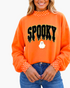 Beach Rose Co. orange sweatshirt with textured SPOOKY graphic, ghost accent, and white polka-dot trim on collar/cuffs.