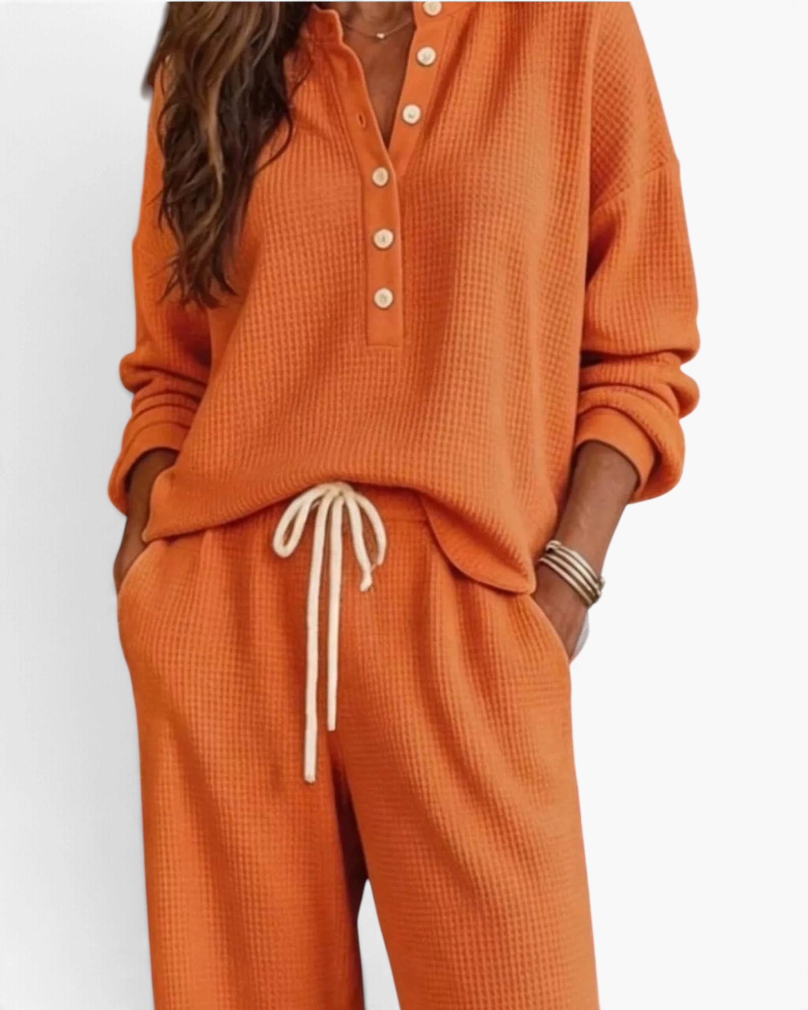 Beach Rose Co. orange waffle-knit two-piece lounge set with button-up top and drawstring pants with pockets.