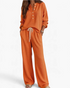 Beach Rose Co. orange waffle knit two-piece lounge set with button-up top and drawstring wide-leg pants