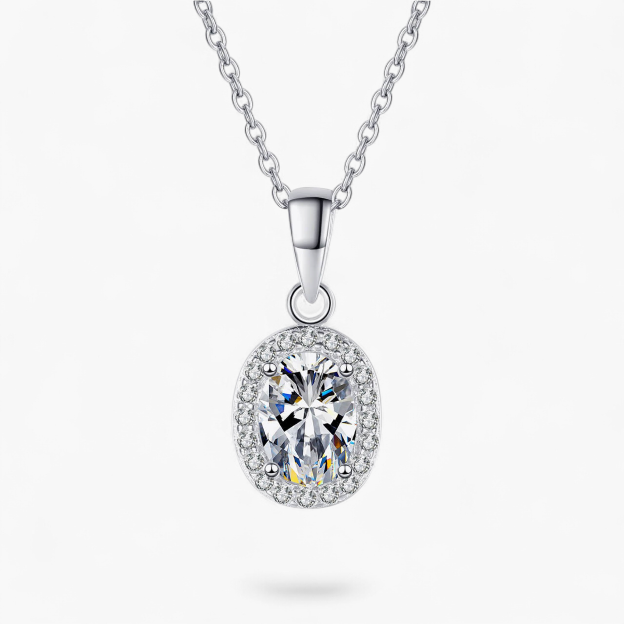 Beach Rose Co. 1 carat oval moissanite pendant necklace in 925 sterling silver with a zircon halo and link chain.