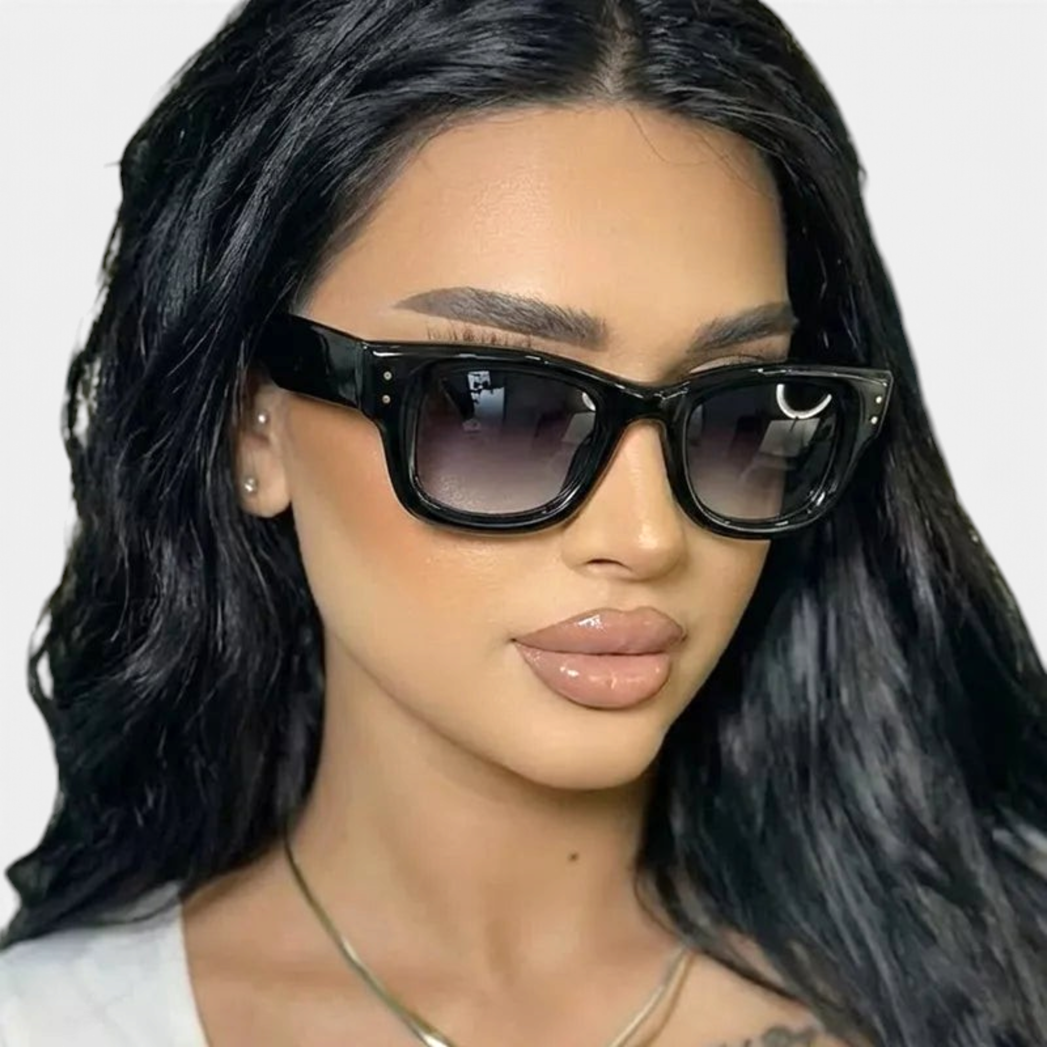 Beach Rose Co. oversized black angular sunglasses with gradient lenses and stud accents worn by a woman.