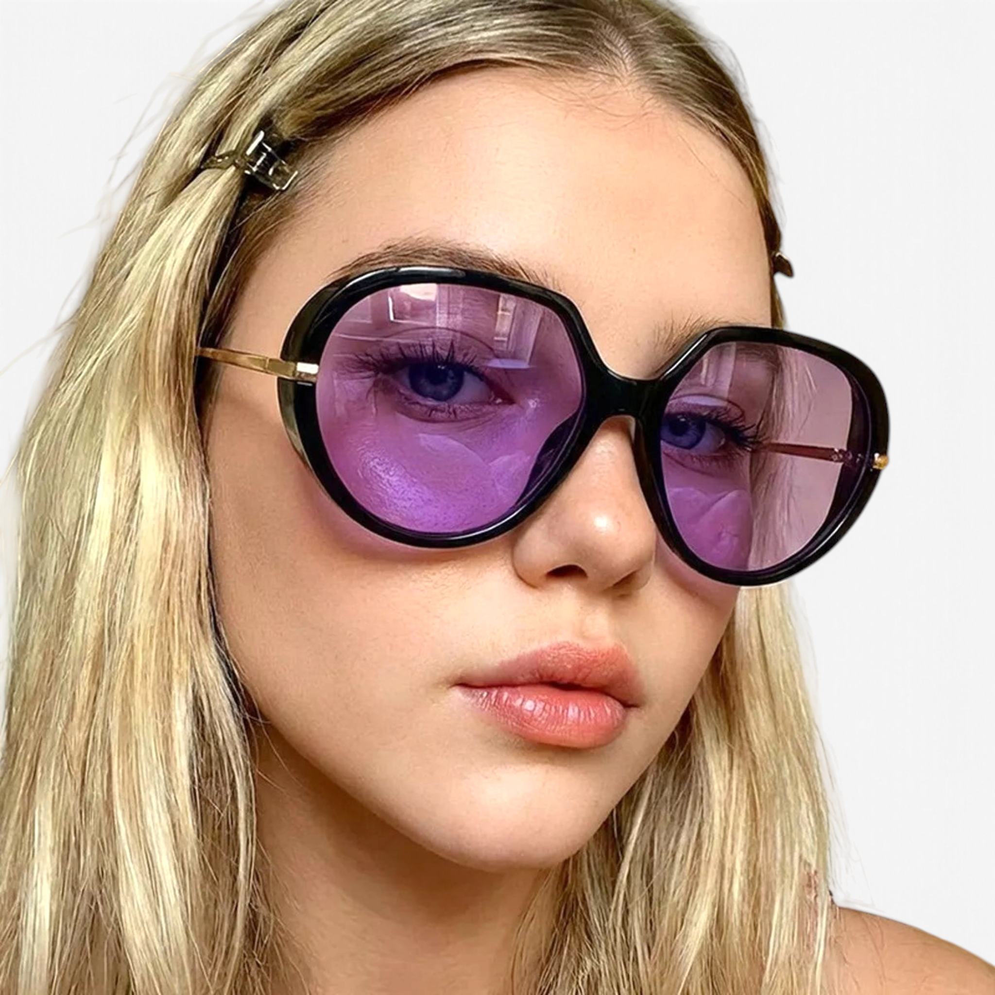 Beach Rose Co. oversized butterfly sunglasses with black frames and purple tinted lenses on a blonde woman