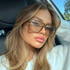 Beach Rose Co. oversized square sunglasses with a flat-top browline and translucent brown frames on a woman in a car.