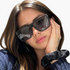 Beach Rose Co. oversized square sunglasses with a flat-top browline and black frames worn by a woman.
