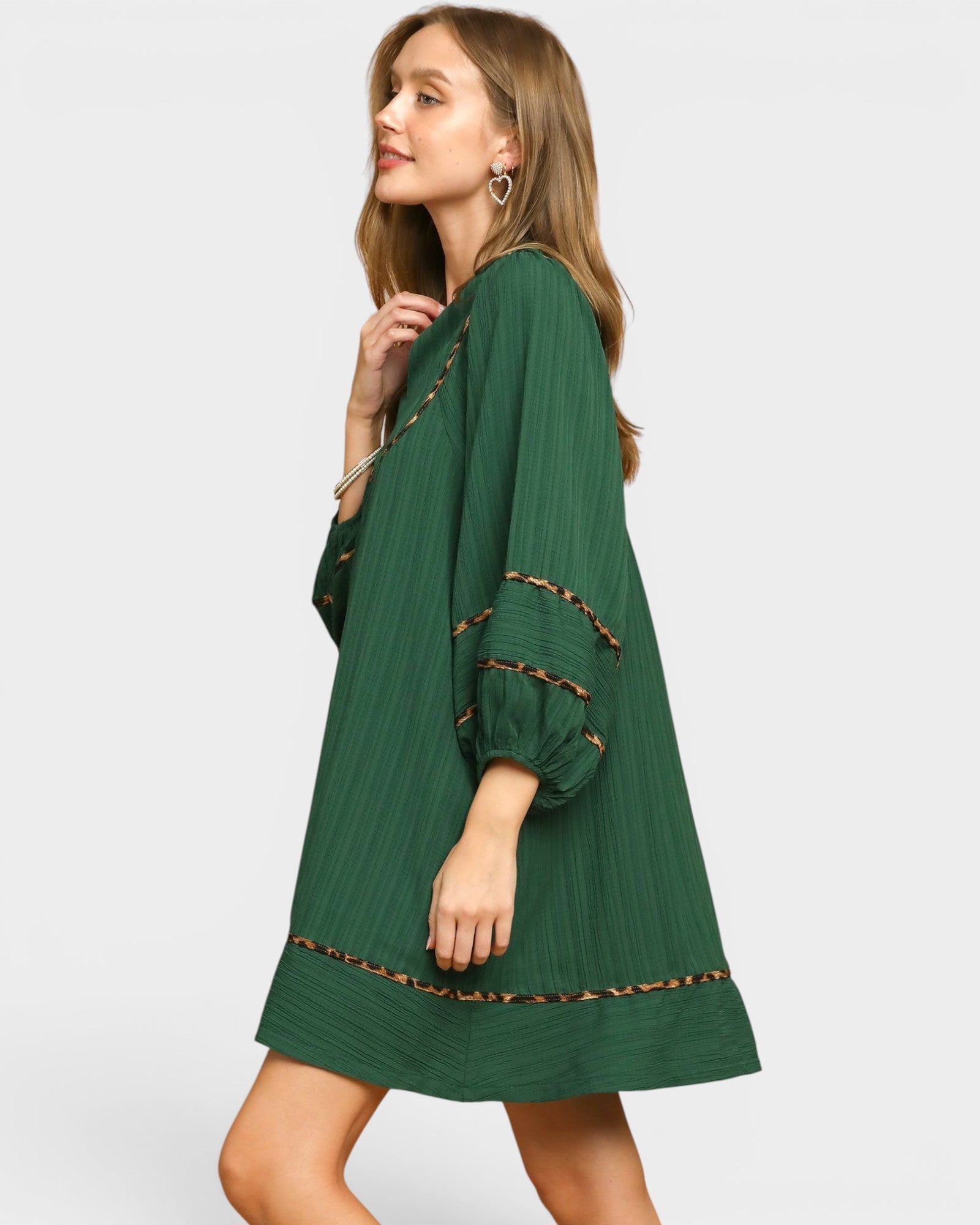 Beach Rose Co. palm green mini dress with balloon sleeves, leopard-print trim, and a relaxed, flowy silhouette.