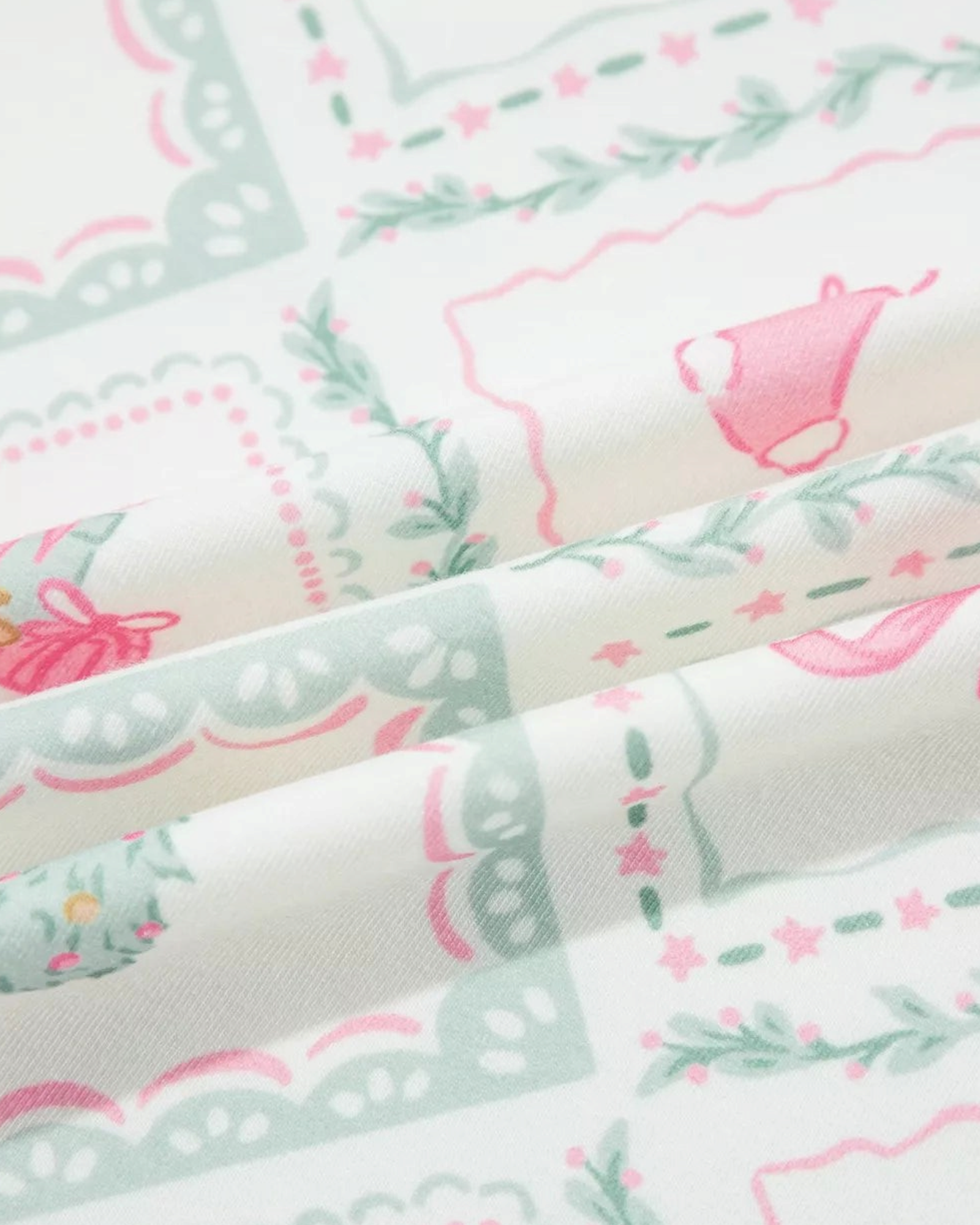 Beach Rose Co. pastel Christmas diamond print fabric with pink and mint holiday motifs on a cream background