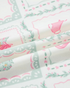 Beach Rose Co. pastel Christmas diamond print fabric with pink and mint holiday motifs on a cream background