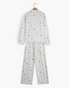 Beach Rose Co. two-piece pajama set in cream with a pastel Christmas diamond print, long sleeves, and straight pants.