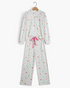 Beach Rose Co. two-piece pajama set in cream with pastel Christmas diamond print, Henley top, and pink ribbon tie.