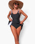 Beach Rose Co. one-piece swimsuit featuring a black and leopard print patchwork design with an adjustable tie-up waist.