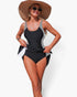 Beach Rose Co. one-piece swimsuit featuring a black and white striped patchwork design with an adjustable tie-up waist.