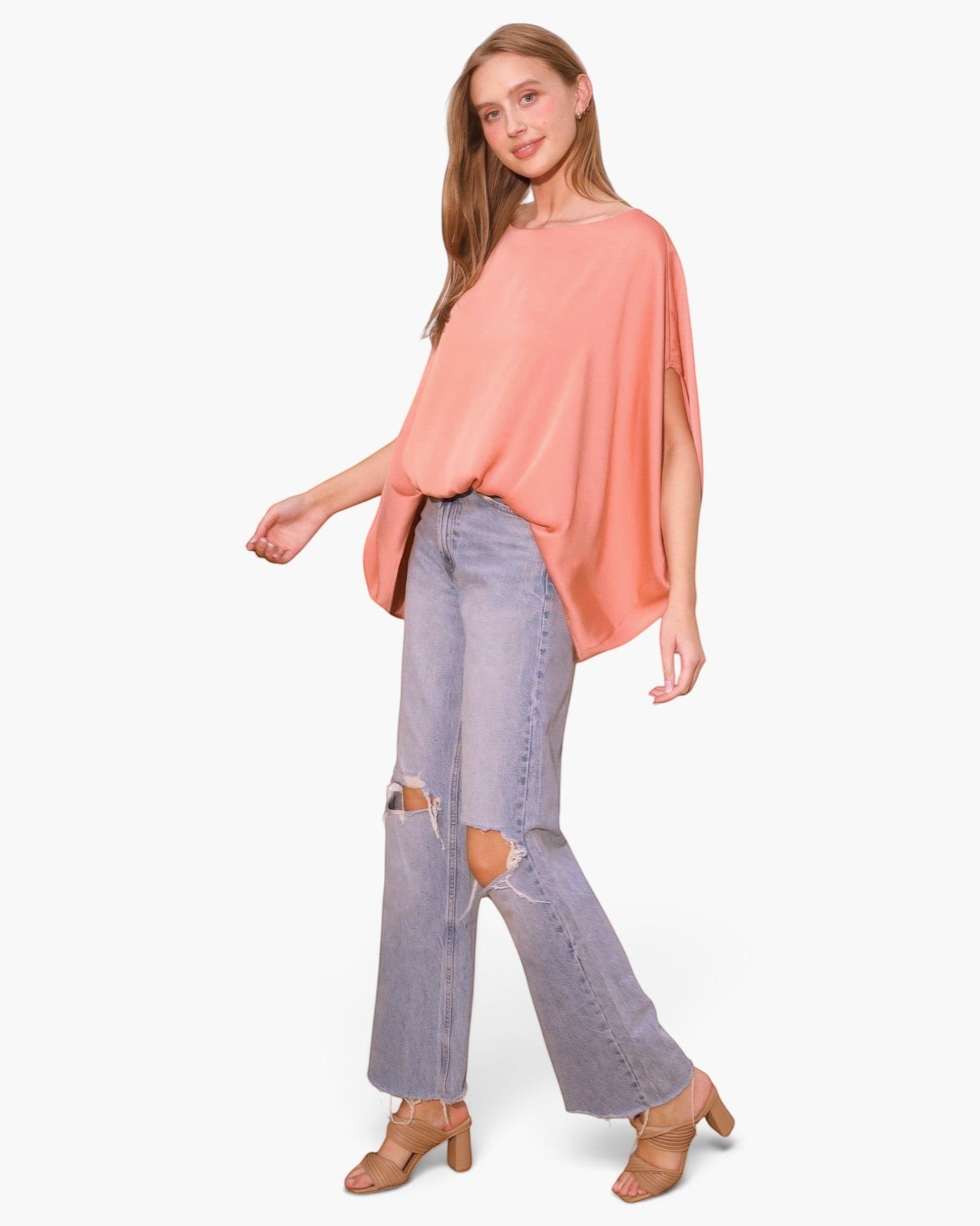 Beach Rose Co. peach washed poly silk boat neck caftan top with flowy sleeves worn with distressed light wash jeans