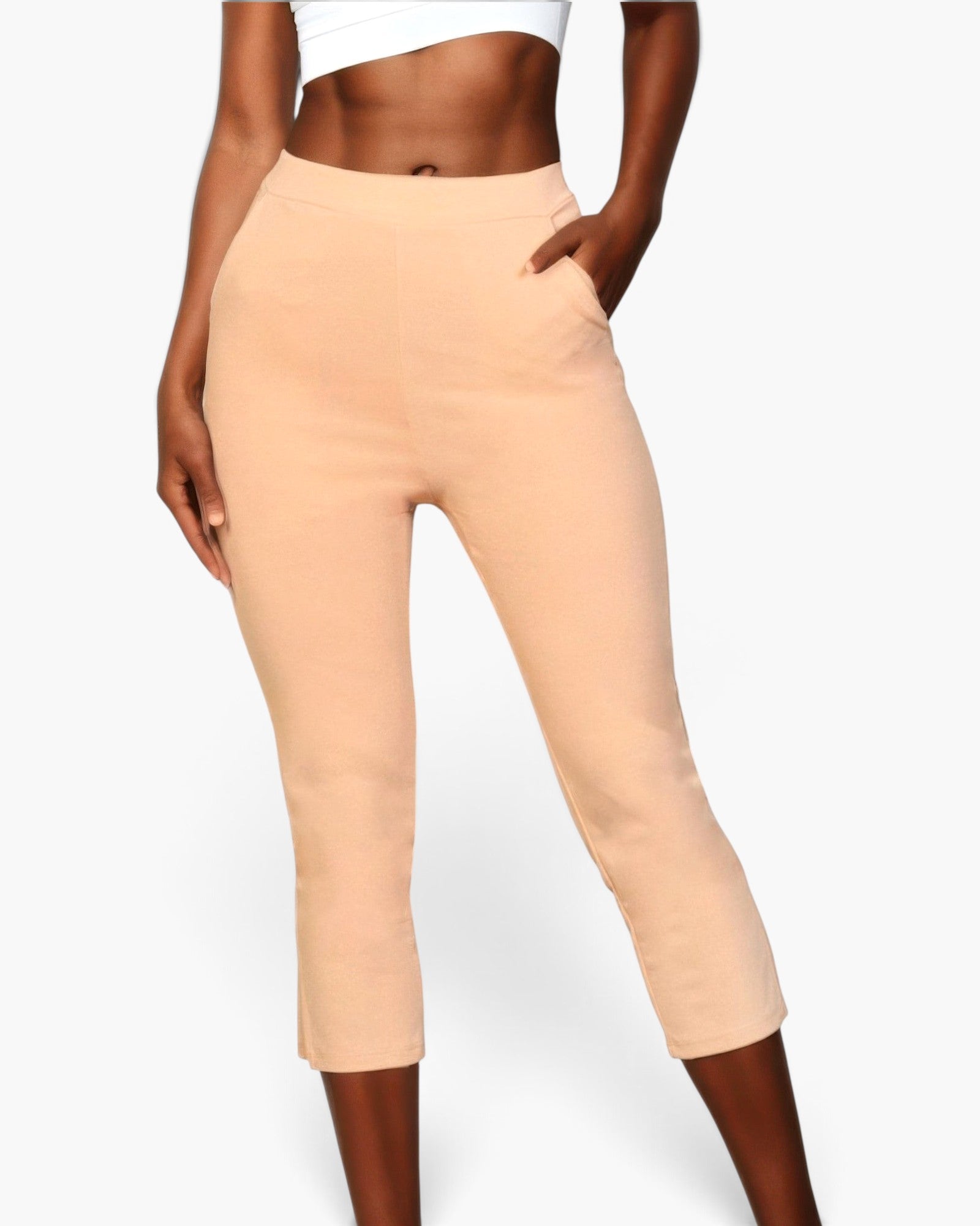 Beach Rose Co. peach cropped pants in stretch crepe fabric with an elastic waist and side slit hem on a model