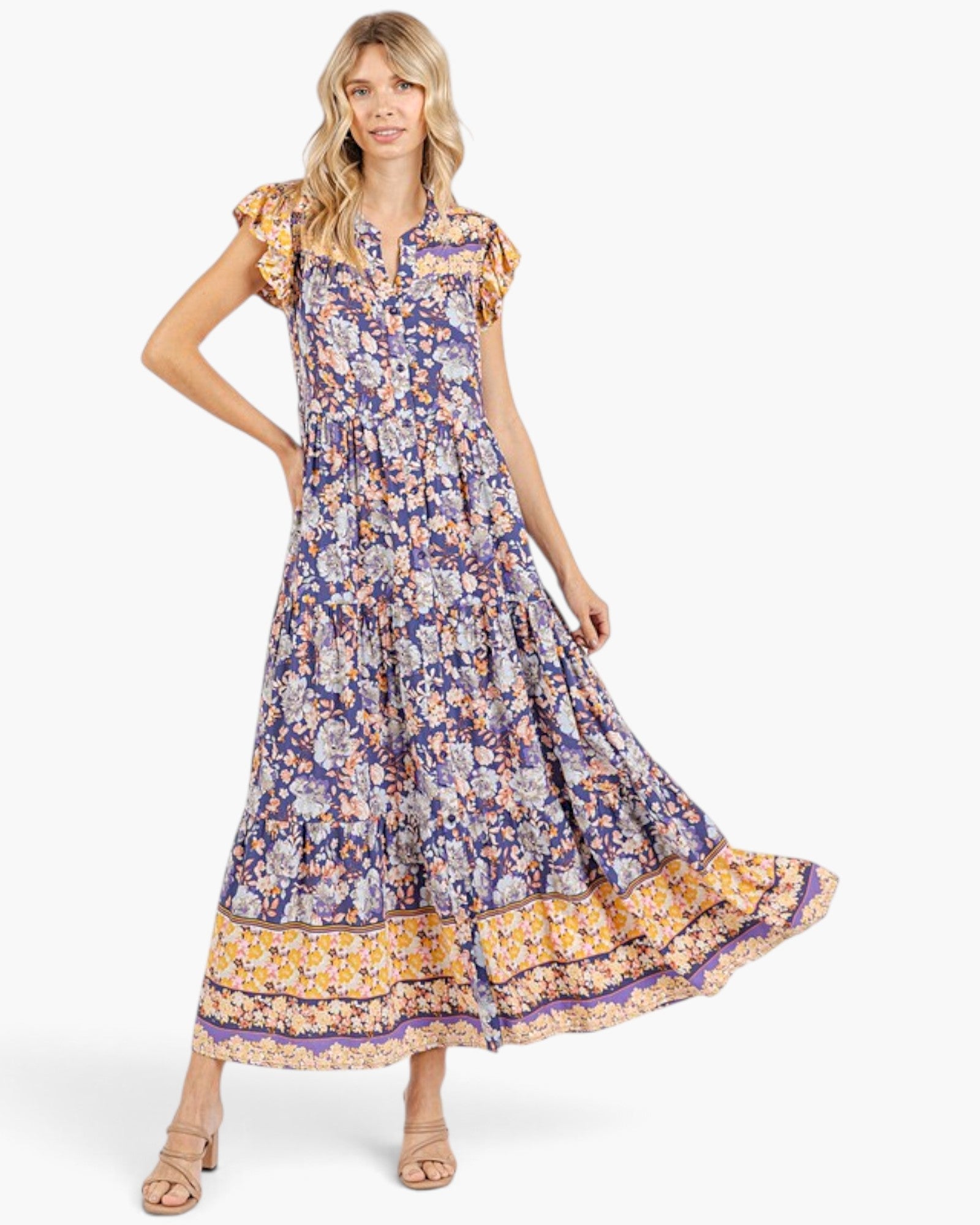 Beach Rose Co. peacock blue floral maxi dress with flutter sleeves, tiered silhouette, and contrasting border print.