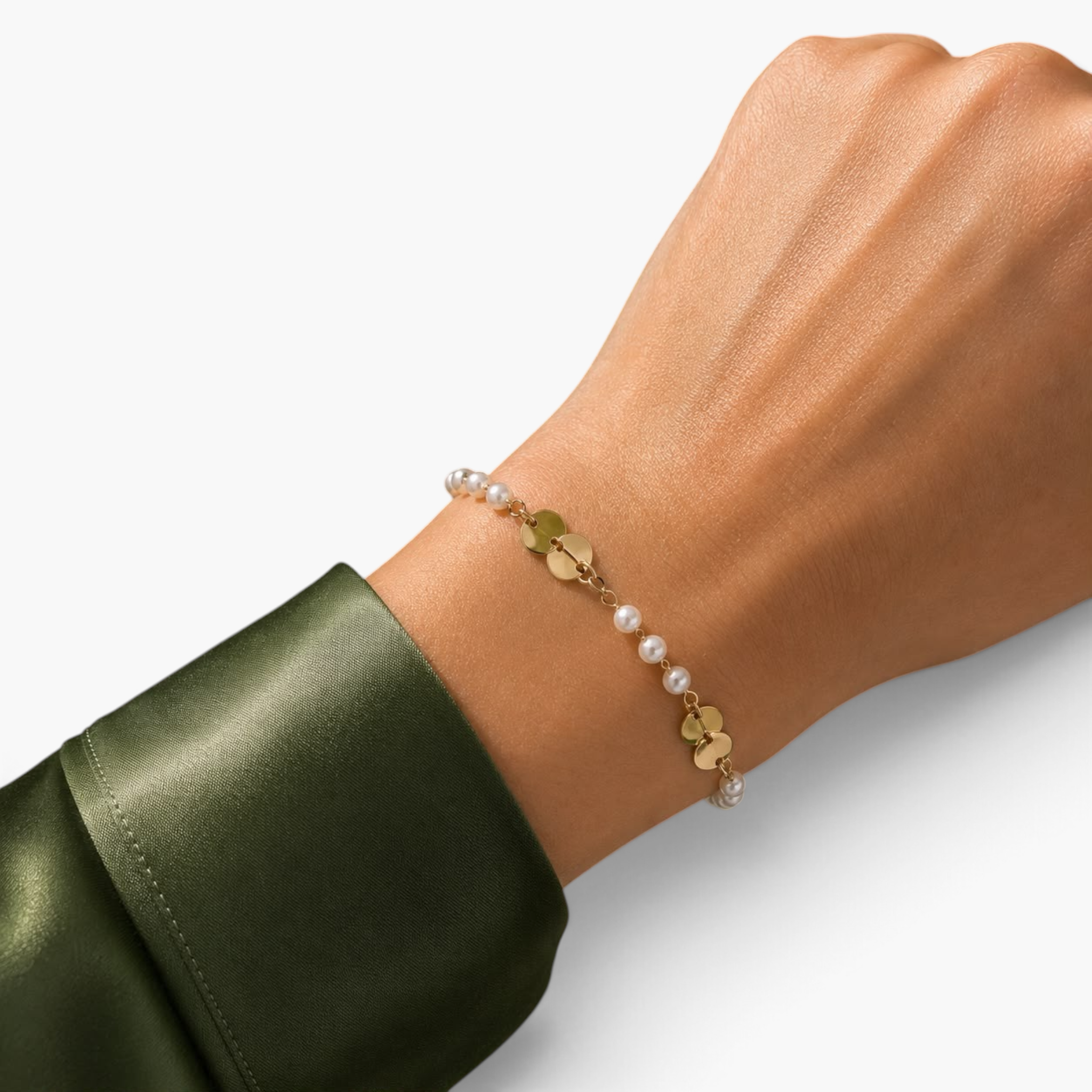 Beach Rose Co. gold filled bracelet featuring alternating synthetic pearls and small polished disc accents on a wrist.