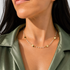 Beach Rose Co. 18K gold filled necklace featuring alternating synthetic pearls and small polished gold discs.