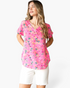 Beach Rose Co. pink V-neck top with a multicolor abstract animal print, cuffed sleeves, and a curved hem.