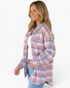 Beach Rose Co. pink and blue plaid shacket with a cream sherpa collar, button front, and chest pockets on a model.