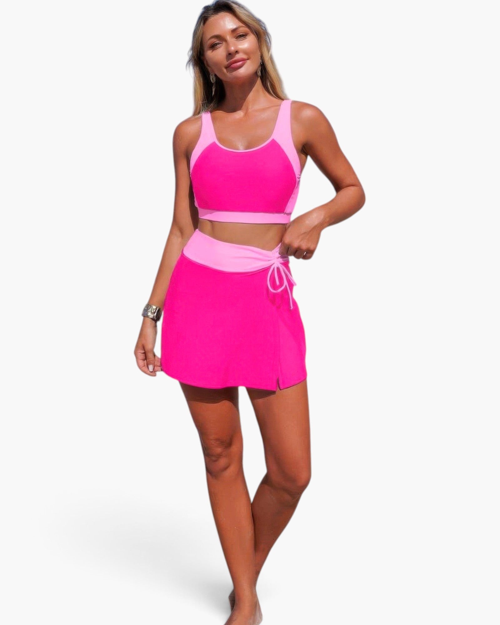 Beach Rose Co. two-piece bikini in hot pink and light pink with a high-waisted skirt bottom and tie-up detail.