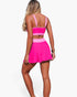 Beach Rose Co. two-piece bikini with a hot pink and light pink color block design and a high-waisted skirt bottom.