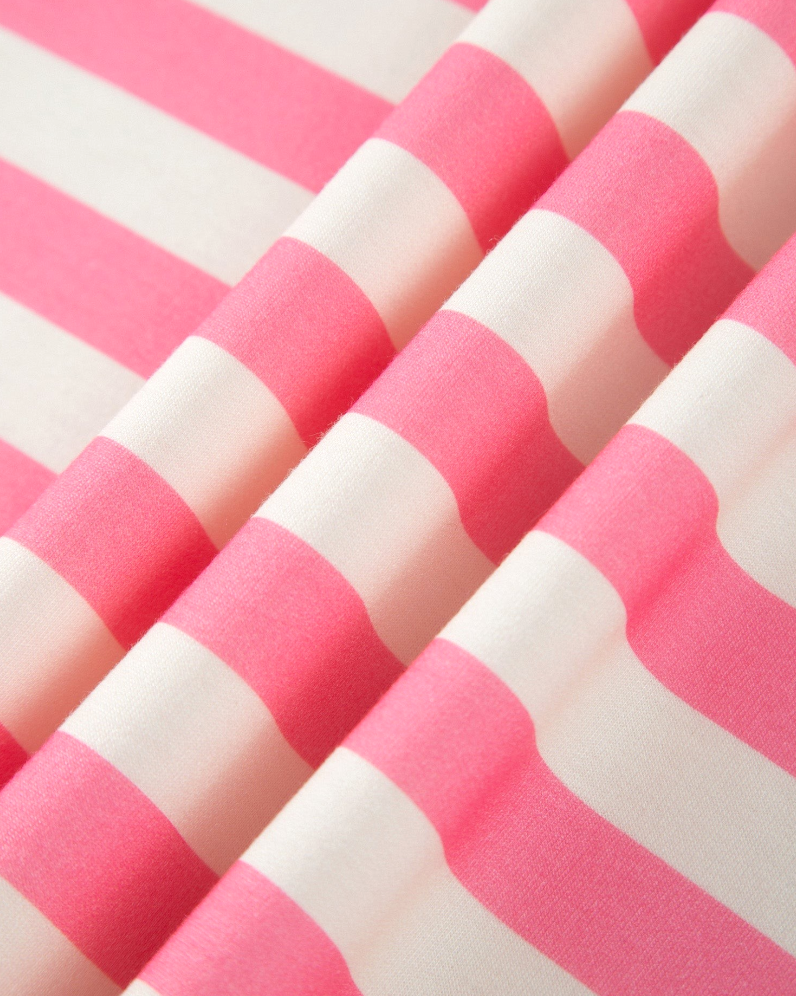 Beach Rose Co. pink and cream horizontal striped polyester blend fabric with soft folds