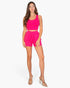 Beach Rose Co. hot pink two-piece set featuring a scoop-neck cropped tank and drawstring shorts on a female model.