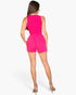 Beach Rose Co. hot pink two-piece set with a cropped tank top and drawstring shorts worn by a model from behind.