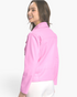 Beach Rose Co. bubblegum pink faux leather moto jacket viewed from the back on a smiling model