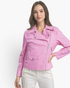 Model wearing a Beach Rose Co. bubblegum pink faux leather moto jacket with silver hardware and notched lapels.